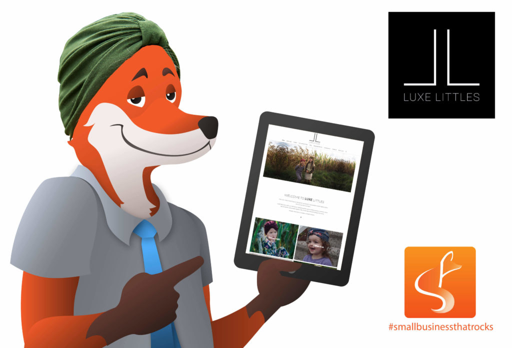 slyfox mascot holding tablet with luxe littles website - SlyFox Web Design and Marketing