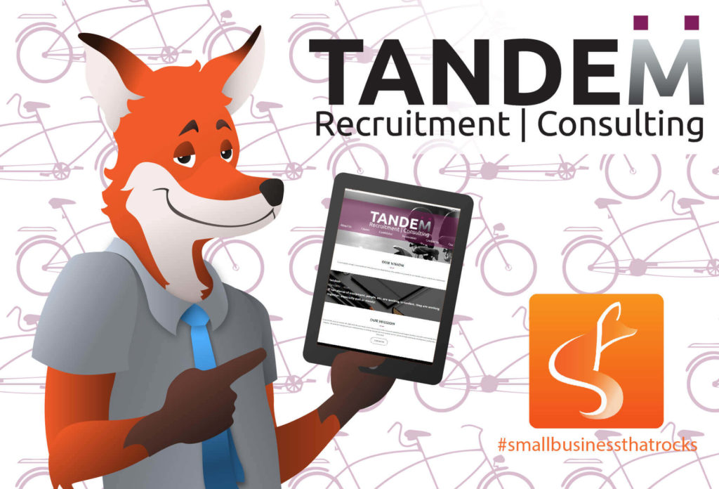 slyfox mascot holding tablet displaying tandem website - SlyFox Web Design and Marketing