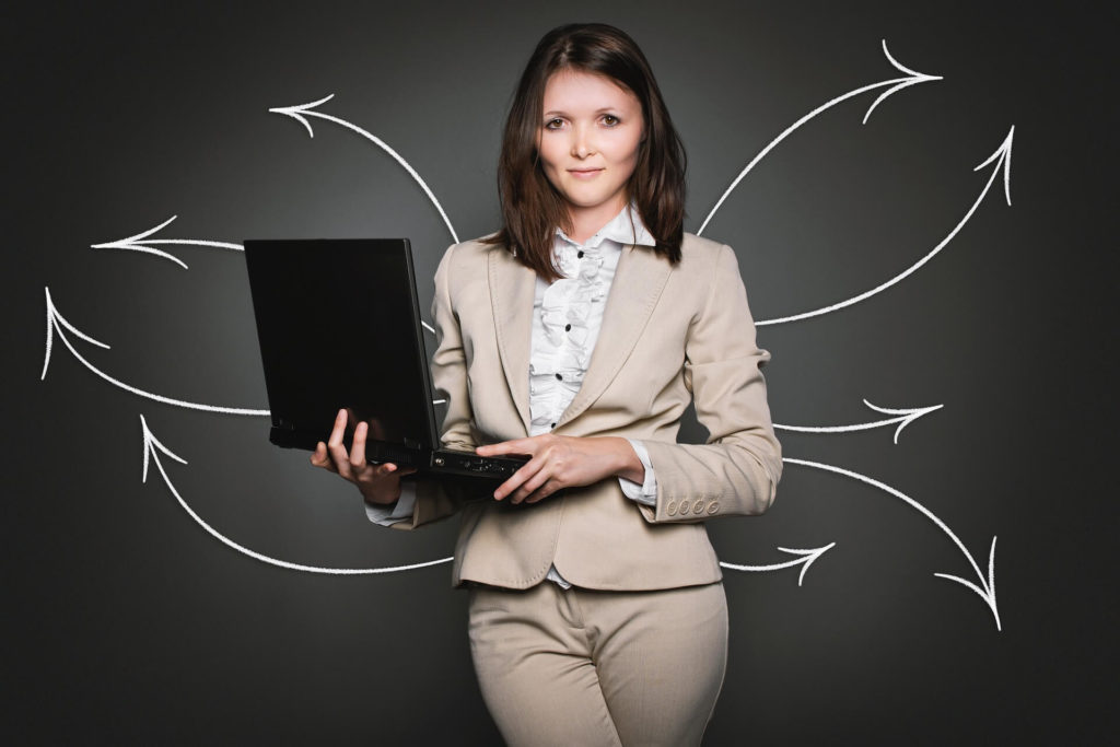 woman holding laptop - SlyFox Web Design and Marketing