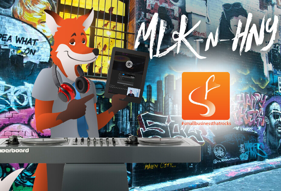 slyfox mascot holding tablet with mlknhny website - SlyFox Web Design and Marketing