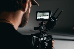 man using video camera